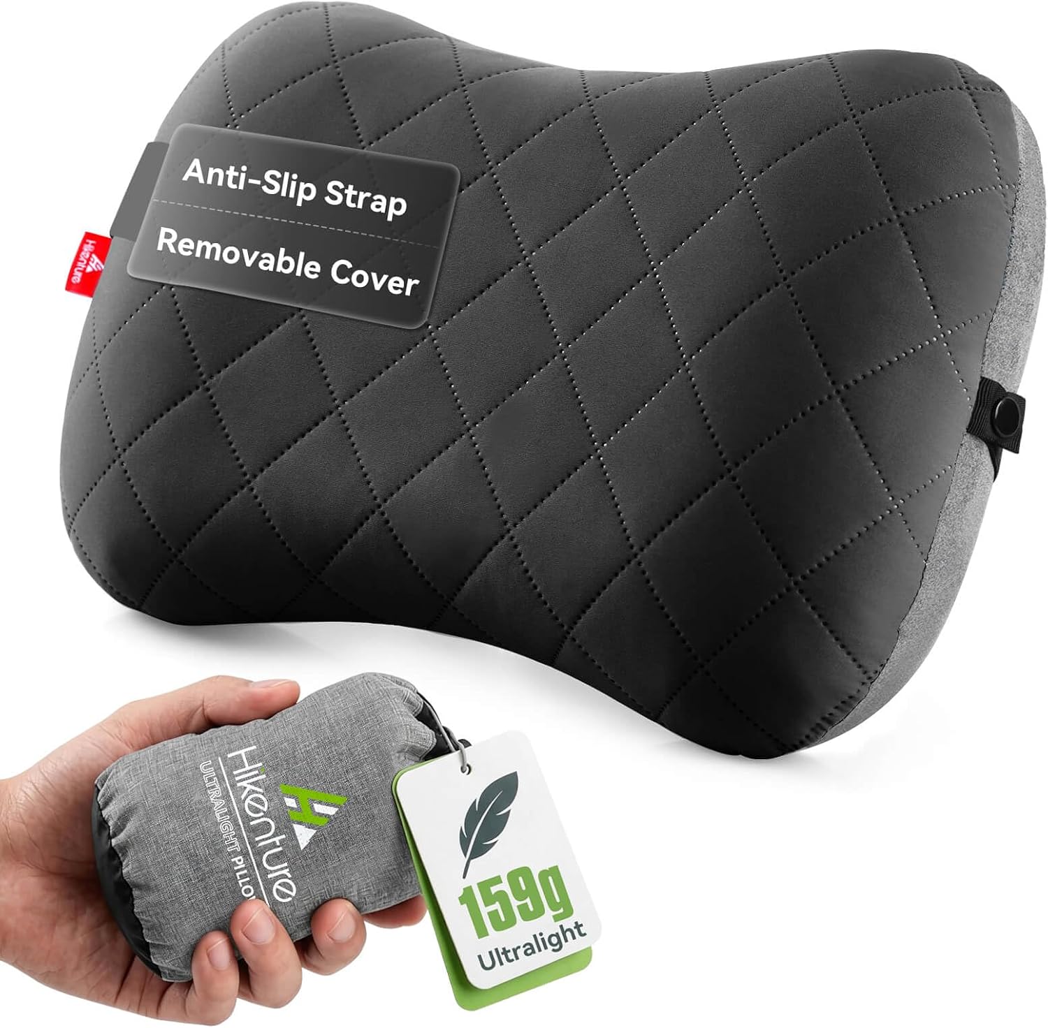 Grey HIKENTURE inflatable camping pillow with quilted removable cover beside a hand holding its packed stuff sack with a 159g ultralight tag