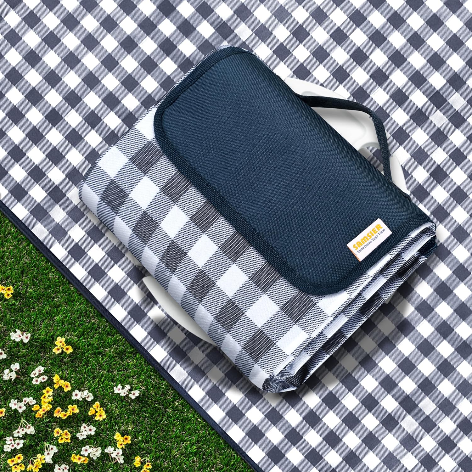 SAMSIER navy blue gingham waterproof picnic blanket spread out on grass
