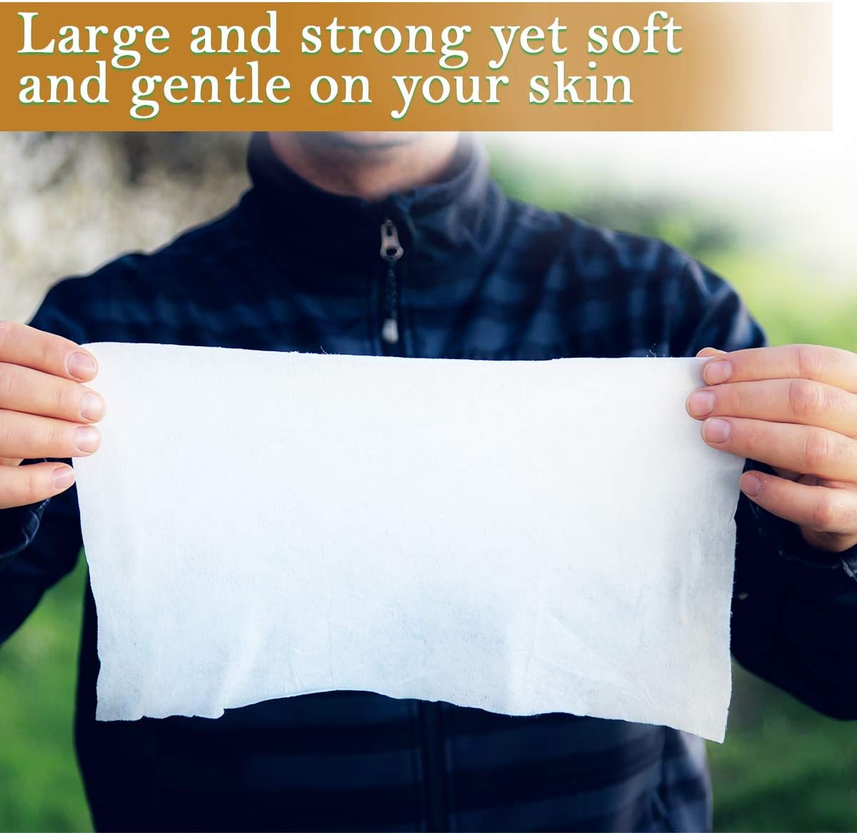 Man holding up a single large Ace Travel Buddy bamboo wipe showing its flannel size