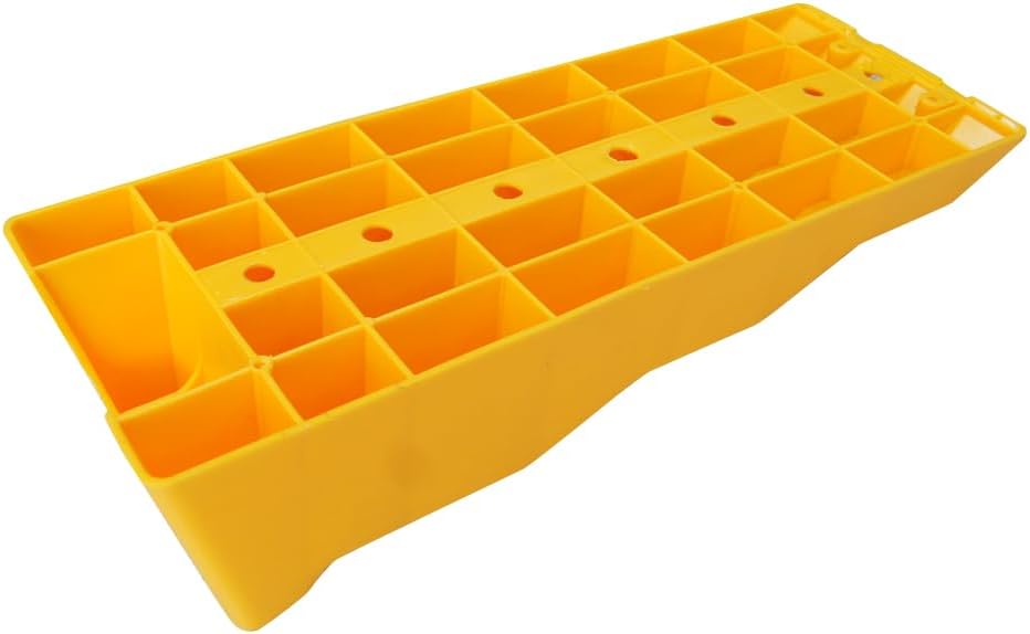 Underside of a KATSU levelling ramp showing the open honeycomb cell structure and drainage holes