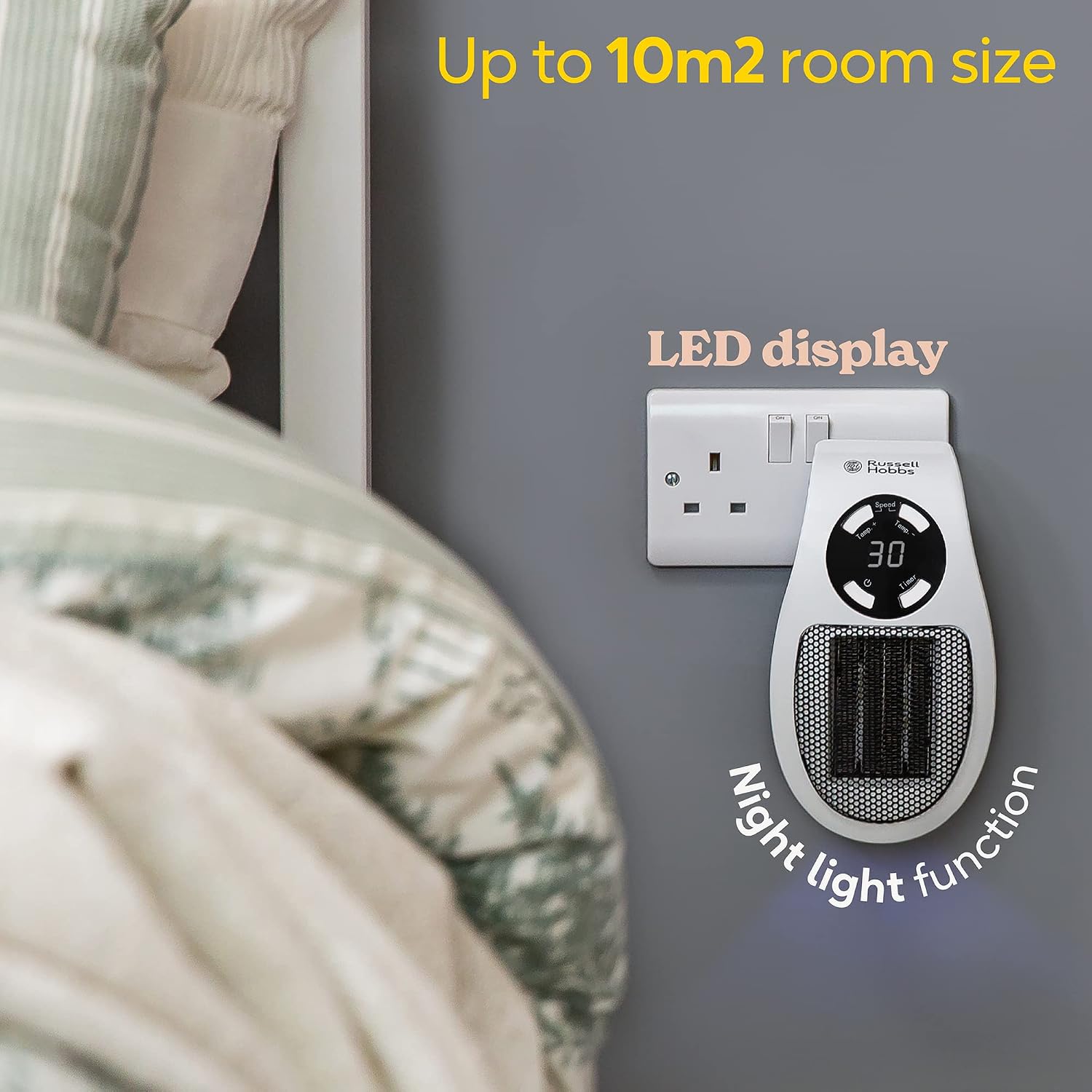 The heater at a bedside with bedding in the foreground, captioned Up to 10m2 room size, LED display and Night light function, with a blue glow at its base