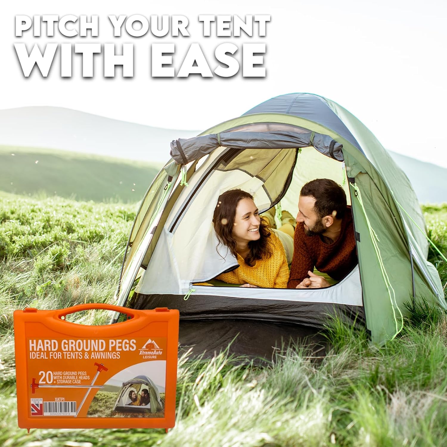 The orange Xtremeauto hard ground pegs carry case pictured beside a tent pitched on a grassy hillside