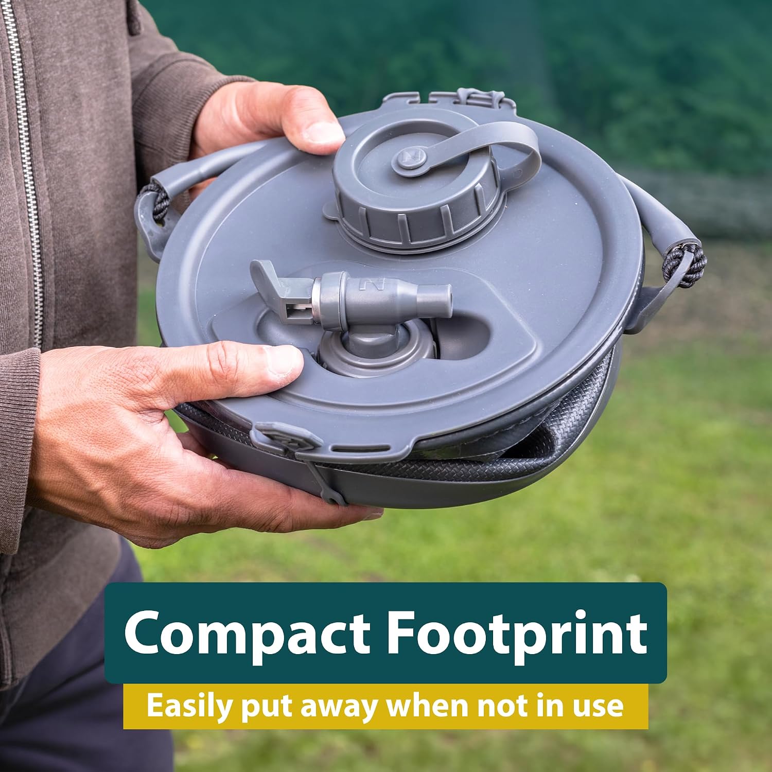 Colapz 8L container fully collapsed into a flat disc held in two hands, with the lid, screw cap and stowed tap visible