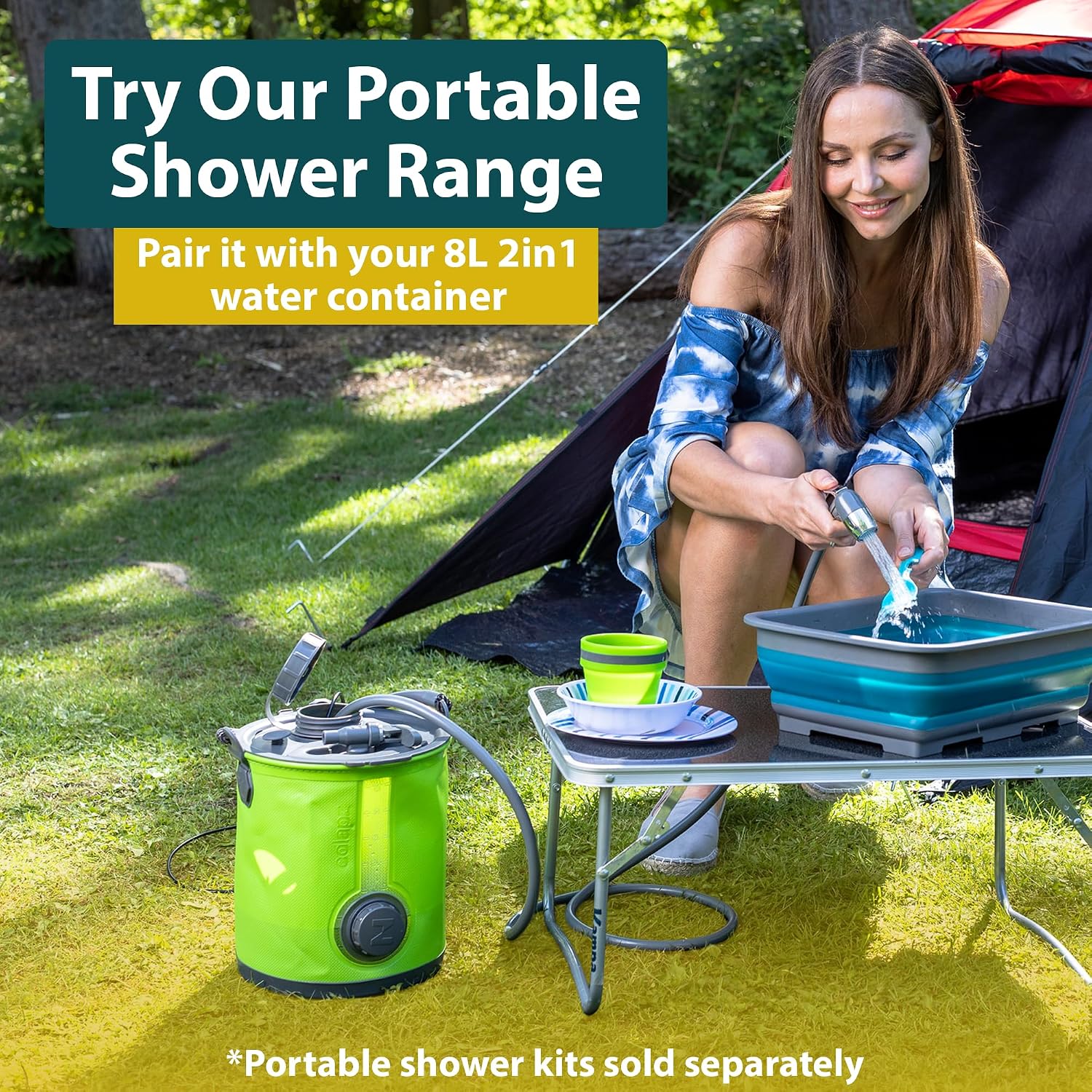 Green Colapz container fitted with a separately sold shower hose and head beside a camping table and a collapsible washing-up bowl