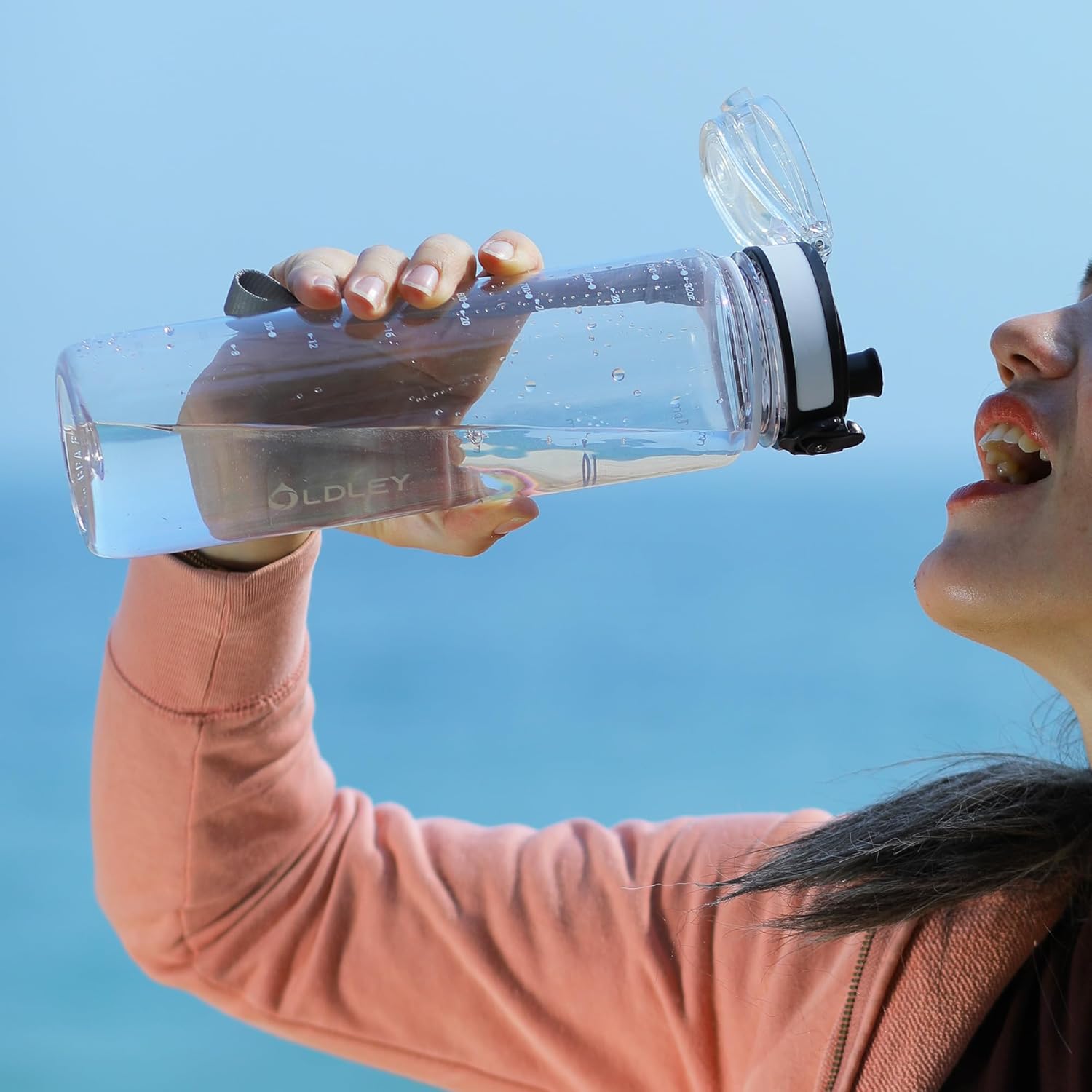 OLDLEY 1L water bottle on a desk with daily time markings visible