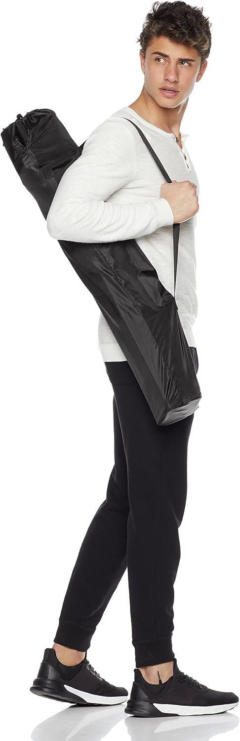 The Amazon Basics camping chair in use outdoors, showing the seated reclined posture