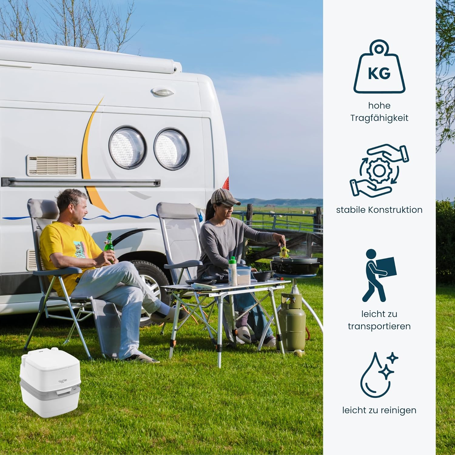 Thetford Porta Potti standing on the grass beside a motorhome pitch with camping chairs and a table