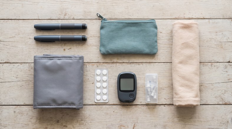 Diabetes camping kit with insulin pens, glucose tablets and a cool bag packed to keep insulin cool while camping