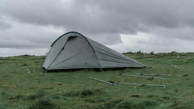 Tunnel tent raised windward end first while pitching in strong wind